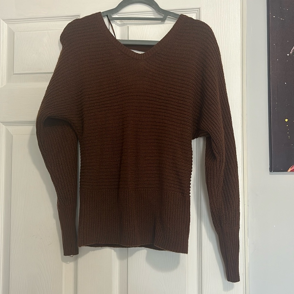 Sweater is super comfy feels like a crop top but very stylish the back is open